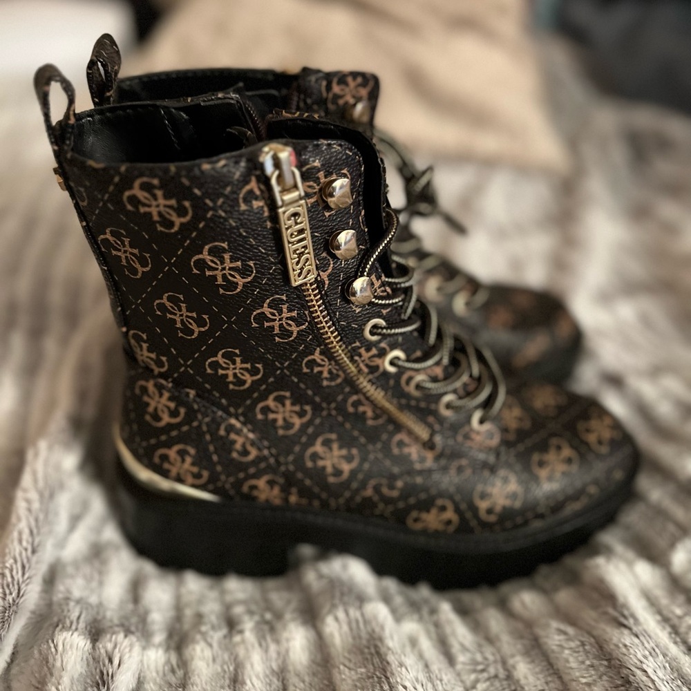Black and gold Guess boots.